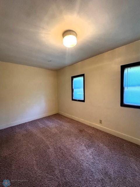 857 Main St, Mahnomen, MN 56557 - carpeted empty room featuring baseboards