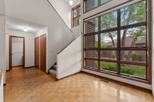 1369 Spencer Rd W, Saint Paul, MN 55108 - staircase featuring baseboards