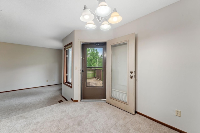 1369 Spencer Rd W, Saint Paul, MN 55108 - entryway with light colored carpet and a chandelier