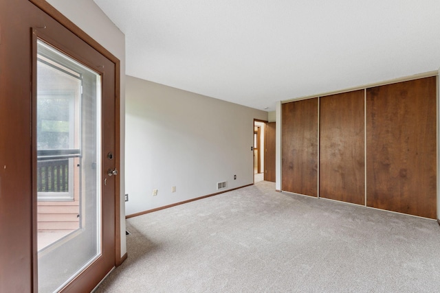1369 Spencer Rd W, Saint Paul, MN 55108 - unfurnished bedroom featuring carpet floors, multiple windows, and a closet