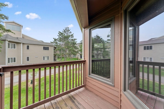 1369 Spencer Rd W, Saint Paul, MN 55108 - wooden terrace featuring a residential view and a lawn