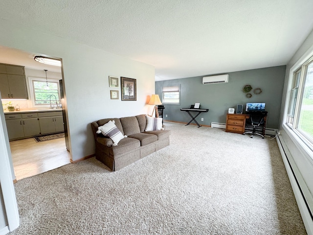 906 Whitford St, Fergus Falls, MN 56537 - living room featuring a baseboard radiator, a wall mounted AC, an office area, light carpet, and a textured ceiling