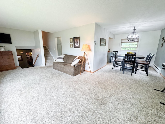906 Whitford St, Fergus Falls, MN 56537 - carpeted living room featuring stairway, a chandelier, and baseboard heating