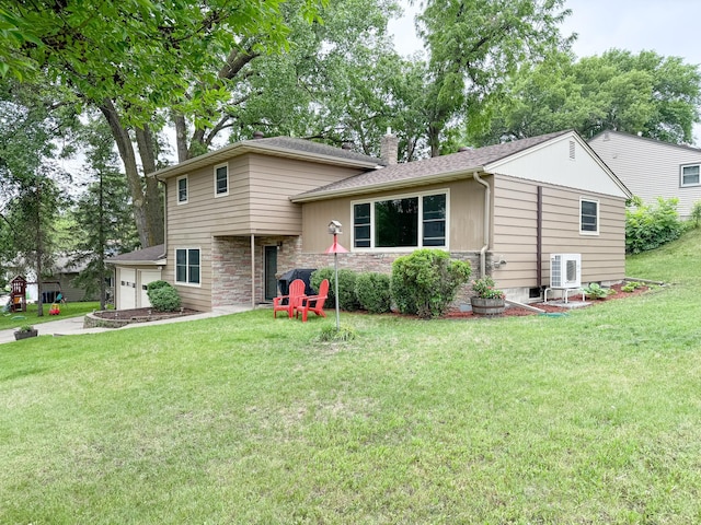 906 Whitford St, Fergus Falls, MN 56537 - split level home featuring stone siding, a chimney, and a front lawn