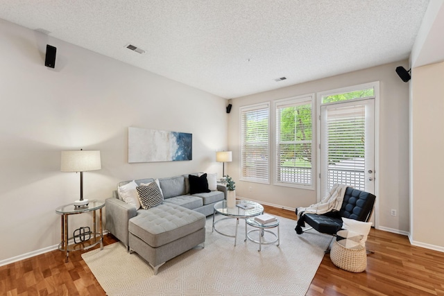 5900 Oxford St Unit 8, Saint Louis Park, MN 55416 - living area with wood finished floors and a textured ceiling