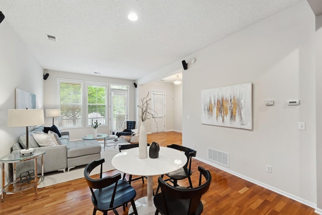 5900 Oxford St Unit 8, Saint Louis Park, MN 55416 - dining area featuring light wood-style floors, a textured ceiling, and recessed lighting
