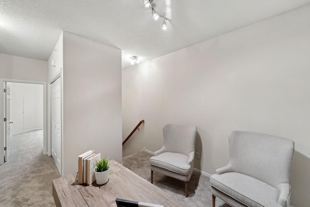 5900 Oxford St Unit 8, Saint Louis Park, MN 55416 - sitting room with an upstairs landing, carpet flooring, and a textured ceiling