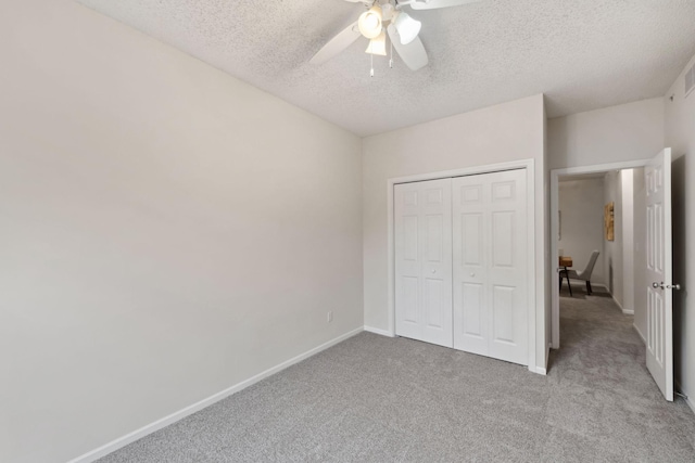 5900 Oxford St Unit 8, Saint Louis Park, MN 55416 - unfurnished bedroom with light carpet, a textured ceiling, a closet, and a ceiling fan