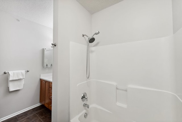 5900 Oxford St Unit 8, Saint Louis Park, MN 55416 - bathroom with a textured ceiling, vanity, tub / shower combination, and tile patterned floors