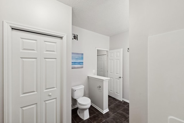 5900 Oxford St Unit 8, Saint Louis Park, MN 55416 - bathroom with a closet, a textured ceiling, and tile patterned floors