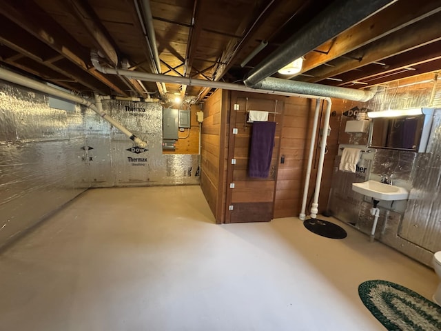 106 Oak Ave, Ottertail, MN 56571 - unfinished below grade area featuring a sink and electric panel