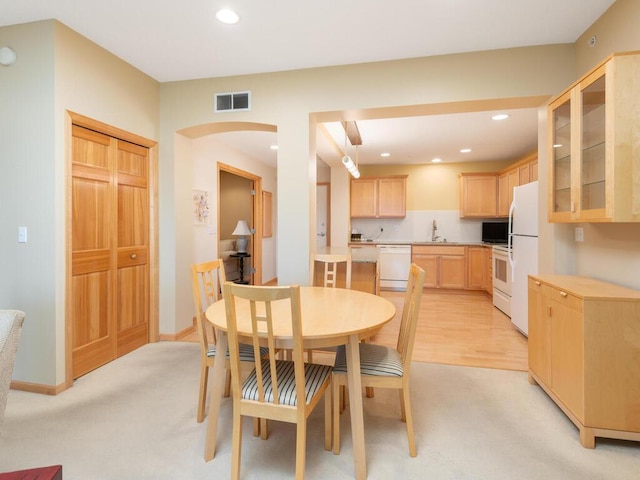 8292 Labont Way Unit 210, Eden Prairie, MN 55344 - dining area with light carpet, recessed lighting, and arched walkways