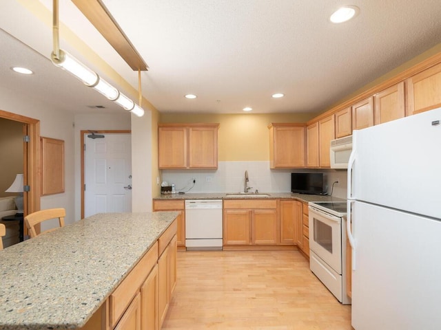 8292 Labont Way Unit 210, Eden Prairie, MN 55344 - kitchen featuring white appliances, light brown cabinets, light wood-style flooring, recessed lighting, and a kitchen island
