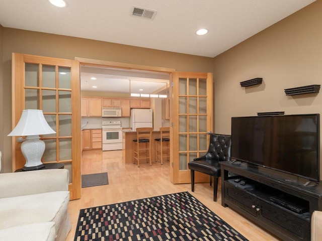8292 Labont Way Unit 210, Eden Prairie, MN 55344 - living area with light wood-style flooring, recessed lighting, and french doors