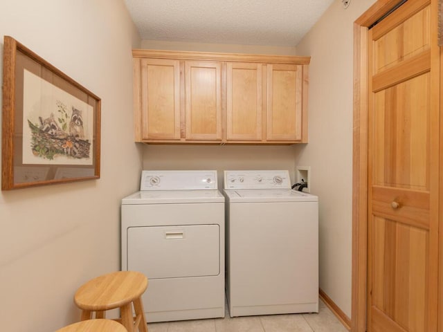 8292 Labont Way Unit 210, Eden Prairie, MN 55344 - washroom featuring washer and dryer, cabinet space, and light tile patterned floors