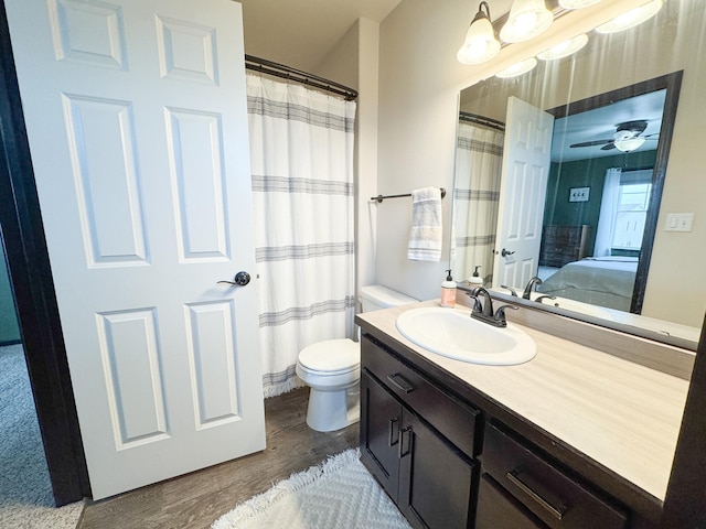 4551 15th St S, Moorhead, MN 56560 - full bath featuring wood finished floors, vanity, and connected bathroom