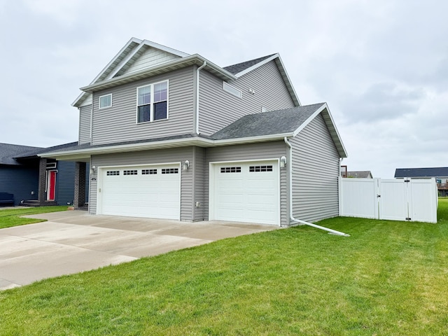 4551 15th St S, Moorhead, MN 56560 - view of front of house with driveway, an attached garage, a gate, and roof with shingles