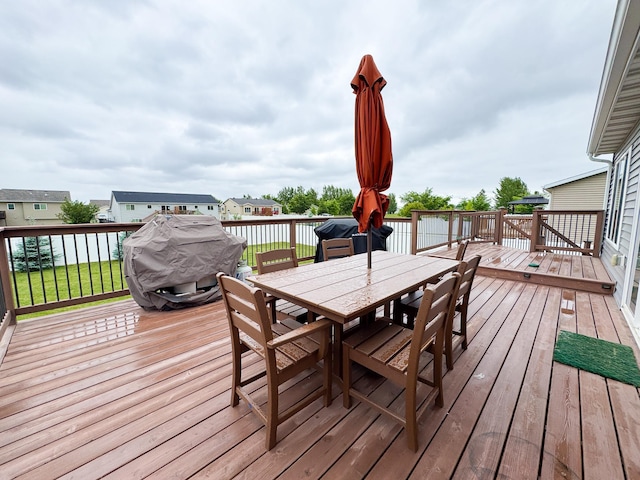 4551 15th St S, Moorhead, MN 56560 - wooden terrace with outdoor dining area and area for grilling