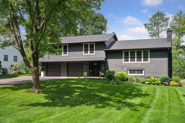 4428 Marlborough Ct, Minnetonka, MN 55345 - split level home with dirt driveway, a front yard, a chimney, and a garage