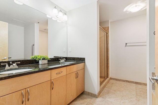 215 10th Ave S Unit 533, Minneapolis, MN 55415 - bathroom with double vanity, a stall shower, and tile patterned flooring