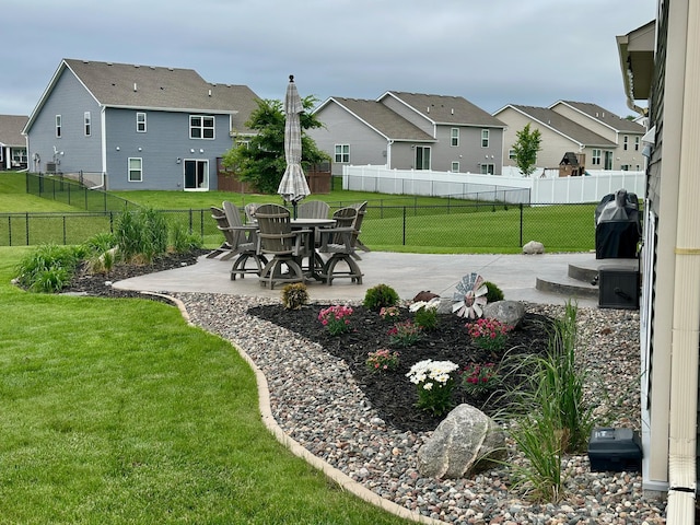 7559 Oday Ln NE, Otsego, MN 55330 - view of yard featuring a patio and a residential view