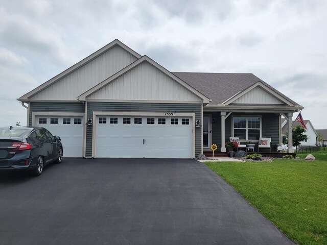 7559 Oday Ln NE, Otsego, MN 55330 - view of front of property with a garage, a front yard, a porch, and driveway