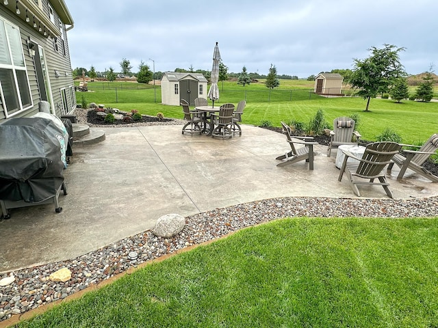 7559 Oday Ln NE, Otsego, MN 55330 - fenced backyard with a storage shed, a patio, and outdoor dining space