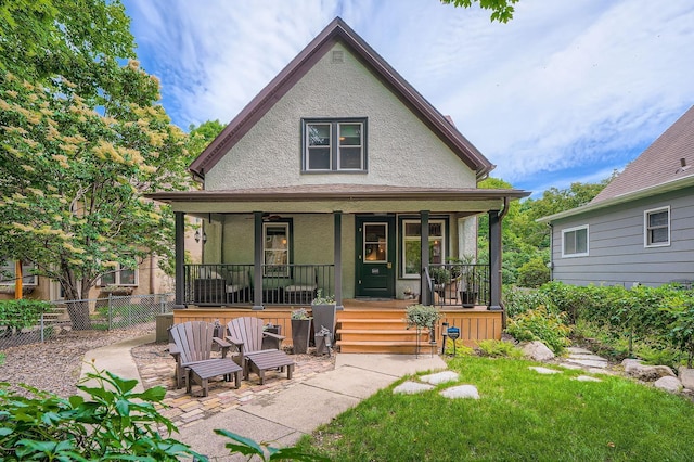 2707 Brighton Ave NE, Minneapolis, MN 55418 - rear view of house featuring a porch and stucco siding
