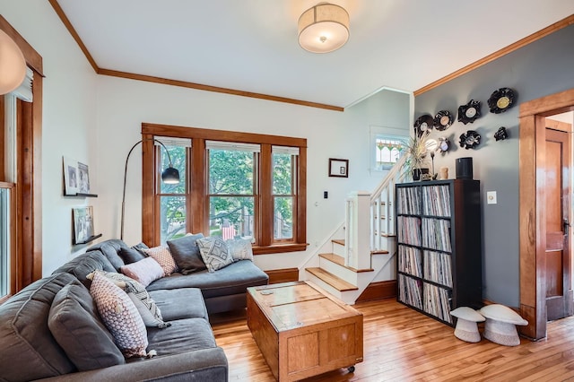2707 Brighton Ave NE, Minneapolis, MN 55418 - living room featuring ornamental molding, light wood finished floors, and stairway