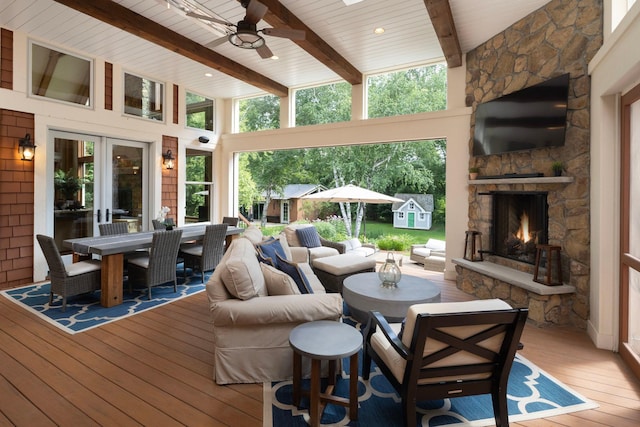 6445 County Road 26, Minnetrista, MN 55364 - wooden deck with outdoor dining area, a ceiling fan, and an outdoor living space with a fireplace