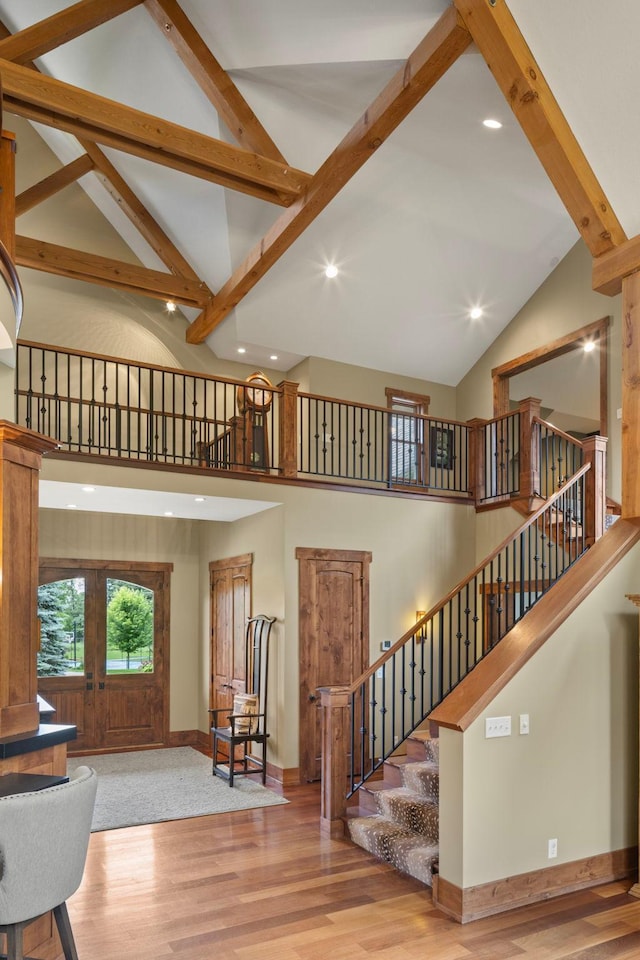6445 County Road 26, Minnetrista, MN 55364 - living room featuring high vaulted ceiling, wood finished floors, stairway, recessed lighting, and beam ceiling