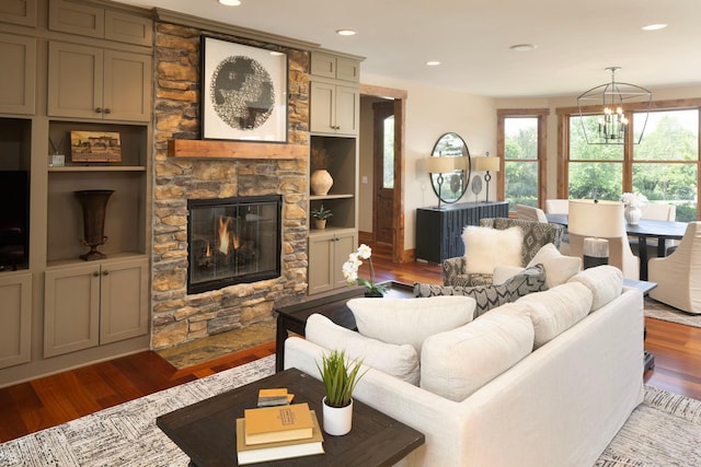 6445 County Road 26, Minnetrista, MN 55364 - living room featuring wood finished floors, a stone fireplace, a chandelier, and recessed lighting