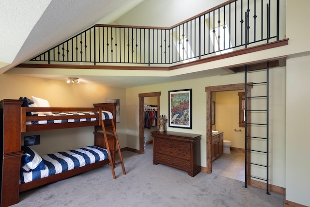 6445 County Road 26, Minnetrista, MN 55364 - bedroom with carpet, a walk in closet, a high ceiling, and connected bathroom
