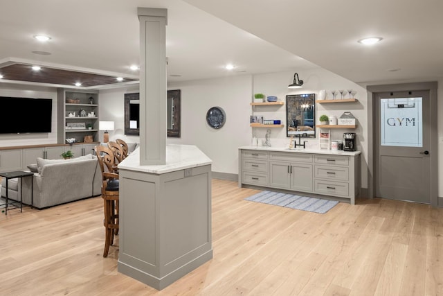 6445 County Road 26, Minnetrista, MN 55364 - kitchen featuring gray cabinets, light wood-style flooring, open shelves, recessed lighting, and a breakfast bar area