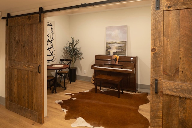 6445 County Road 26, Minnetrista, MN 55364 - sitting room with a barn door and wood finished floors