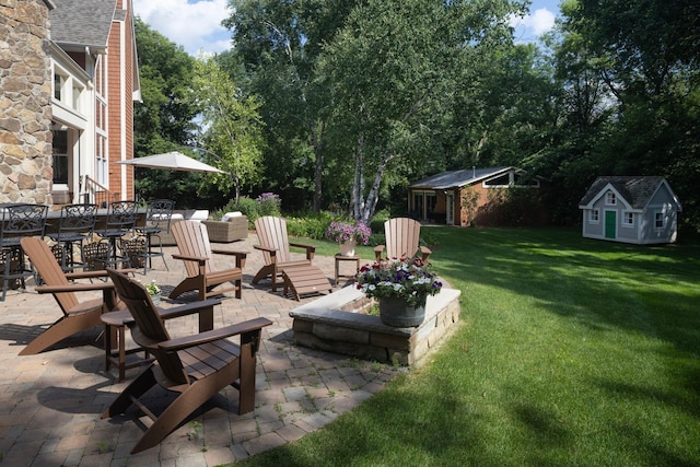 6445 County Road 26, Minnetrista, MN 55364 - view of green lawn with a patio area and an outbuilding