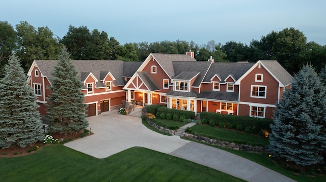 6445 County Road 26, Minnetrista, MN 55364 - view of front facade with driveway, a garage, a chimney, a front lawn, and a porch