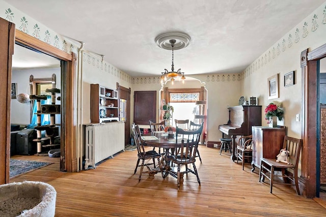 531 2nd St N, Brownton, MN 55312 - dining space with light wood-type flooring and a chandelier