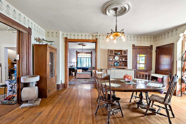 531 2nd St N, Brownton, MN 55312 - dining area with a chandelier and light wood finished floors