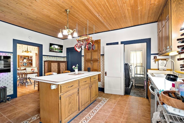 531 2nd St N, Brownton, MN 55312 - kitchen with a chandelier, wood ceiling, light countertops, light tile patterned flooring, and a center island