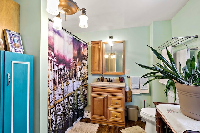 531 2nd St N, Brownton, MN 55312 - full bathroom featuring vanity, wood finished floors, and curtained shower