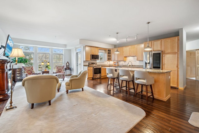1700 Metro Blvd Unit 210, Edina, MN 55439 - living room featuring dark wood-style flooring and track lighting