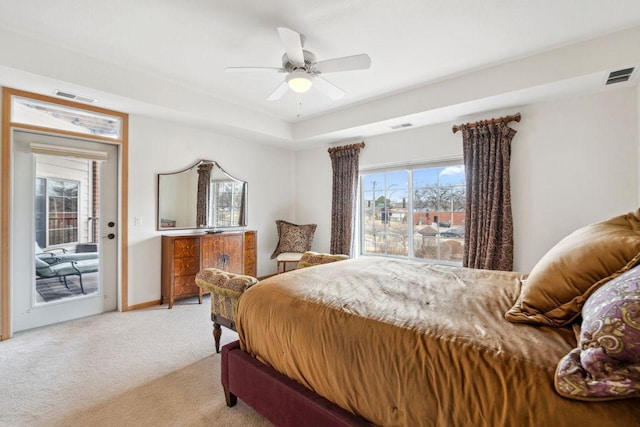 1700 Metro Blvd Unit 210, Edina, MN 55439 - bedroom featuring light carpet, access to outside, ceiling fan, and a tray ceiling