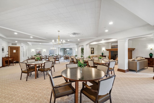 1700 Metro Blvd Unit 210, Edina, MN 55439 - dining area featuring light carpet, ornate columns, a lit fireplace, and recessed lighting