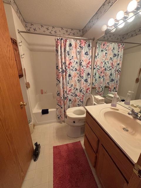 9257 Prairieview Trl N, Champlin, MN 55316 - full bathroom with vanity, a textured ceiling, and shower / bath combination with curtain