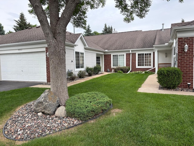 9257 Prairieview Trl N, Champlin, MN 55316 - ranch-style house with brick siding, a front lawn, a shingled roof, a garage, and driveway