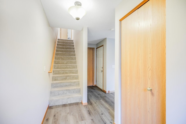 15521 Foghorn Ln, Apple Valley, MN 55124 - staircase with wood finished floors and baseboards