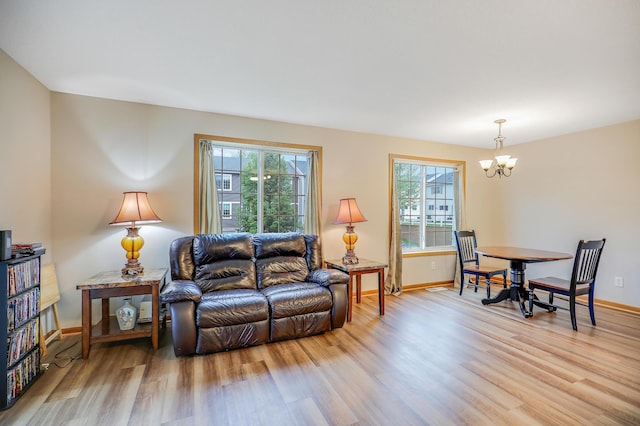 15521 Foghorn Ln, Apple Valley, MN 55124 - living room with light wood-style floors and a chandelier