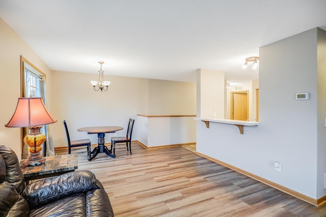 15521 Foghorn Ln, Apple Valley, MN 55124 - living area with a chandelier and light wood-style flooring