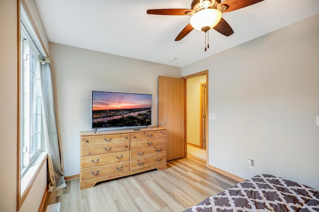 15521 Foghorn Ln, Apple Valley, MN 55124 - bedroom with light wood-style flooring and a ceiling fan